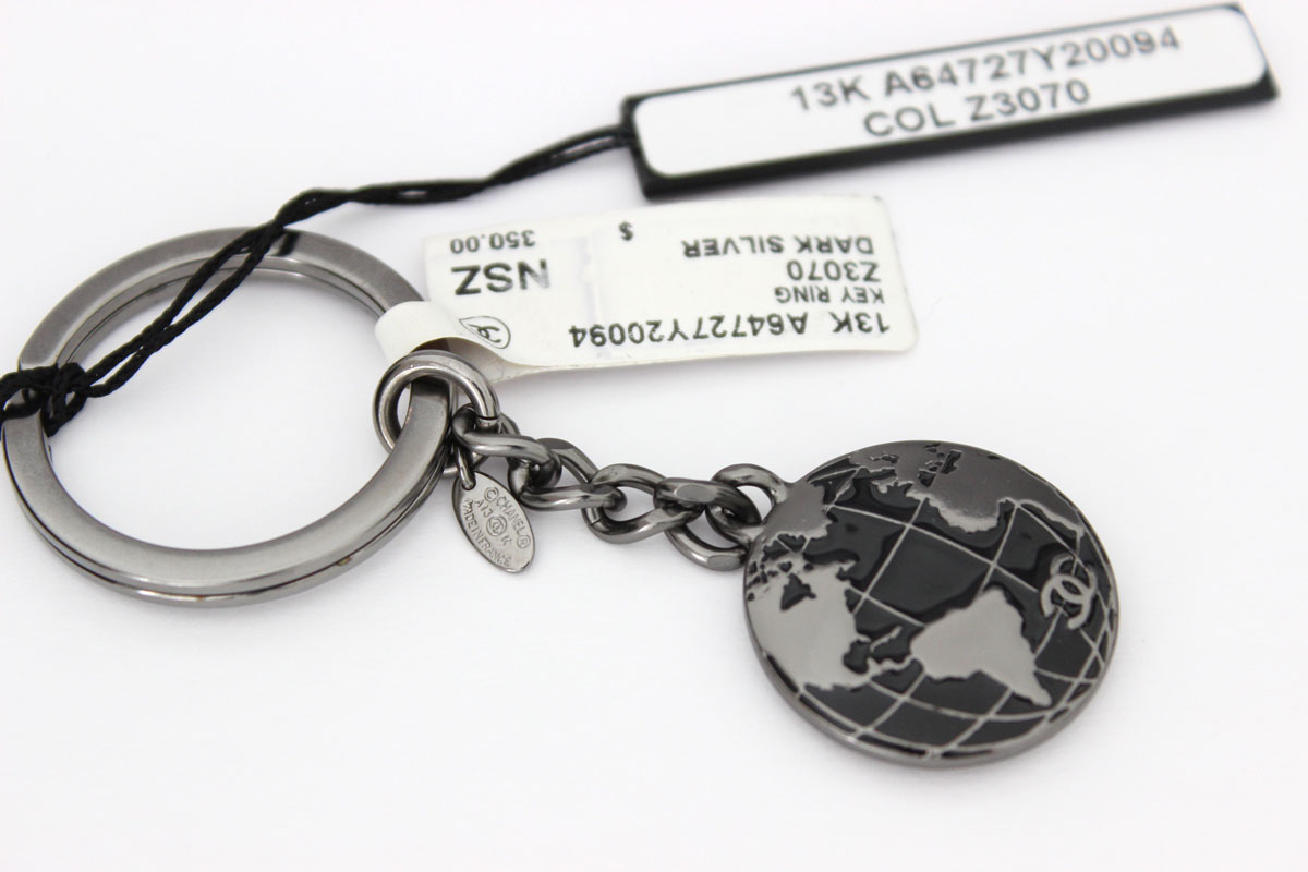 Chanel ruthenium globe key ring at Jill's Consignment