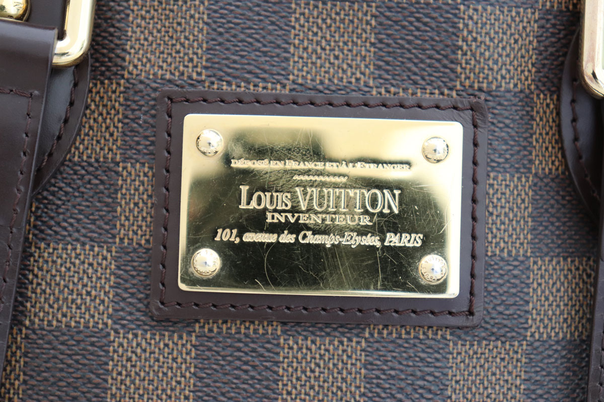 louis vuitton backpack gold plate