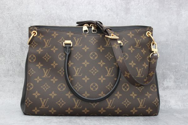 LuvScarlet - LOUIS VUITTON Pallas Monogram Noir. 2015. Measuring 13.5 L x  5 W x 9.5 H. Two outer pockets with invisible magnet closures. Three  interior flat pockets. Double rolled natural leather